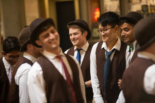 The Brown Derbies sing acapella for ADOCH students after they arrived at the Providence train station.